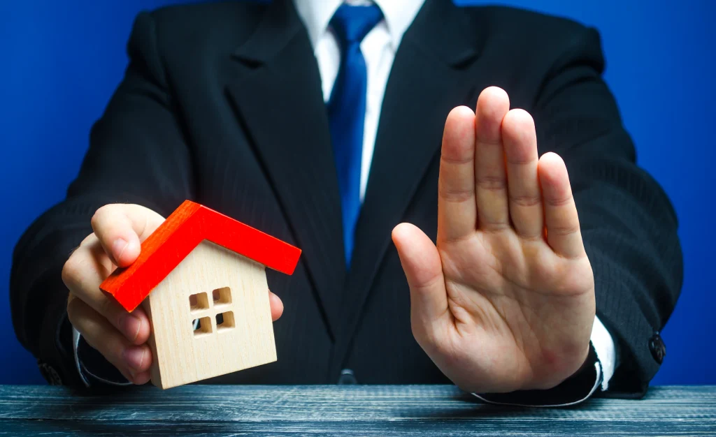 man-holds-house-makes-stop-gesture-bank-refusal-provide-mortgage-refusal-provide-legally-guaranteed-housing-confiscation-pledged-property-denial-insurance-payment