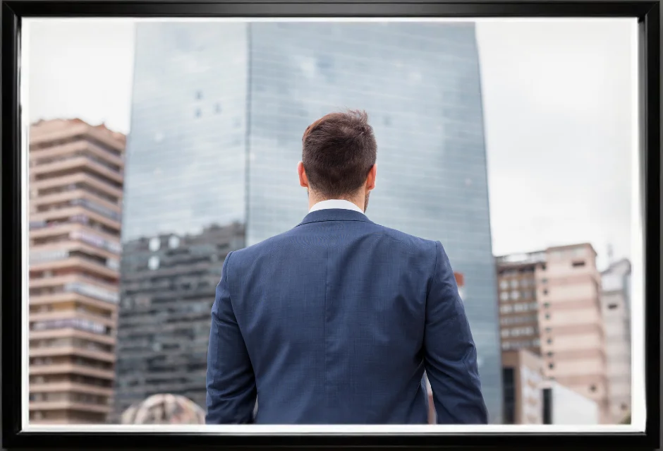 real estate agent looking towards the high rise building